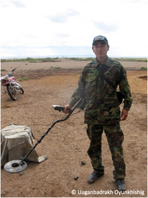 Uuganbadrakh with metal detector