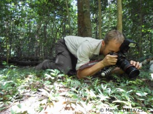 Dr Turner photographing frogs-low