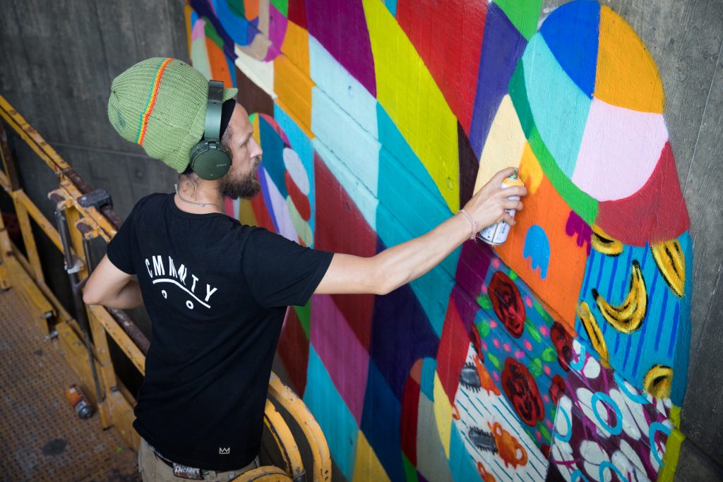 Street artist Louis Masai paints EDGE murals at ZSL London Zoo