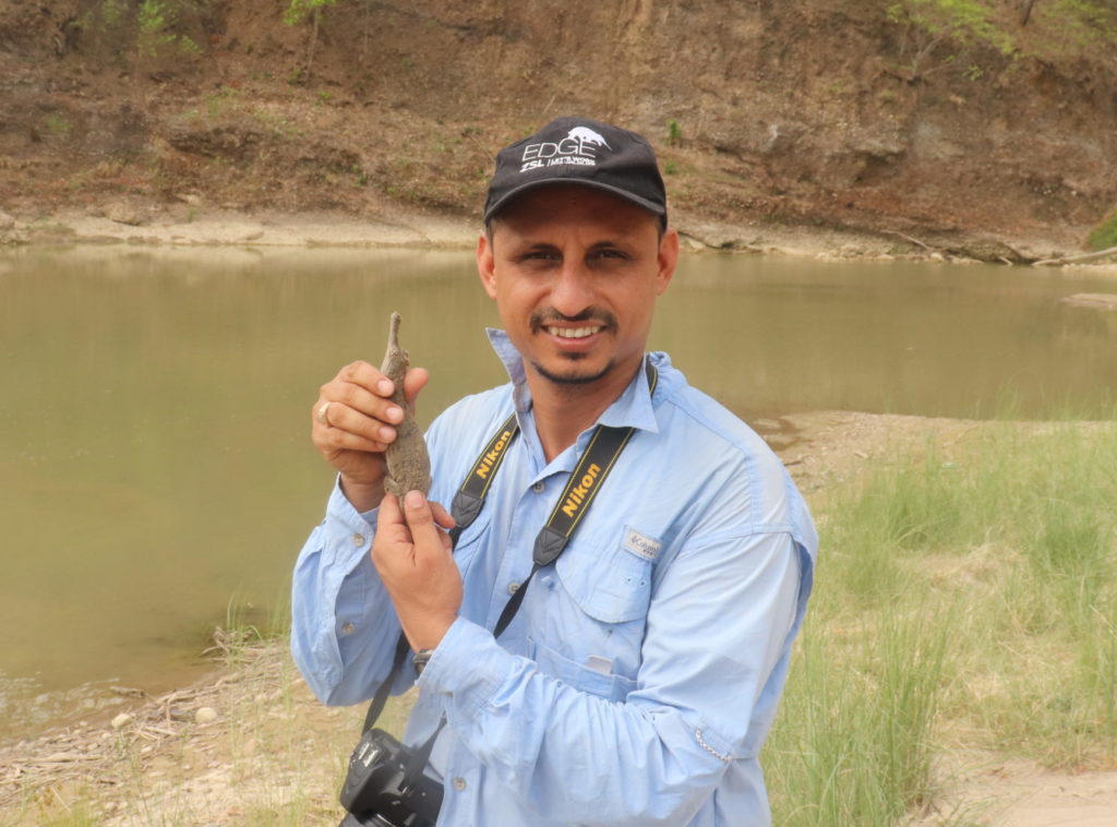 Ashish Bashyal holding a juvenile gharial